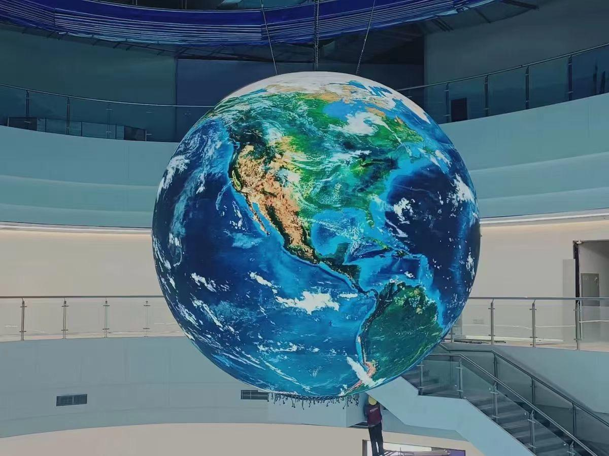 Application example of a spherical LED display showing a globe inside a building